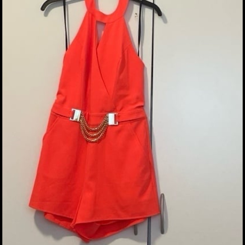 Bebe Bright Orange Halter Romper with Chain Accent